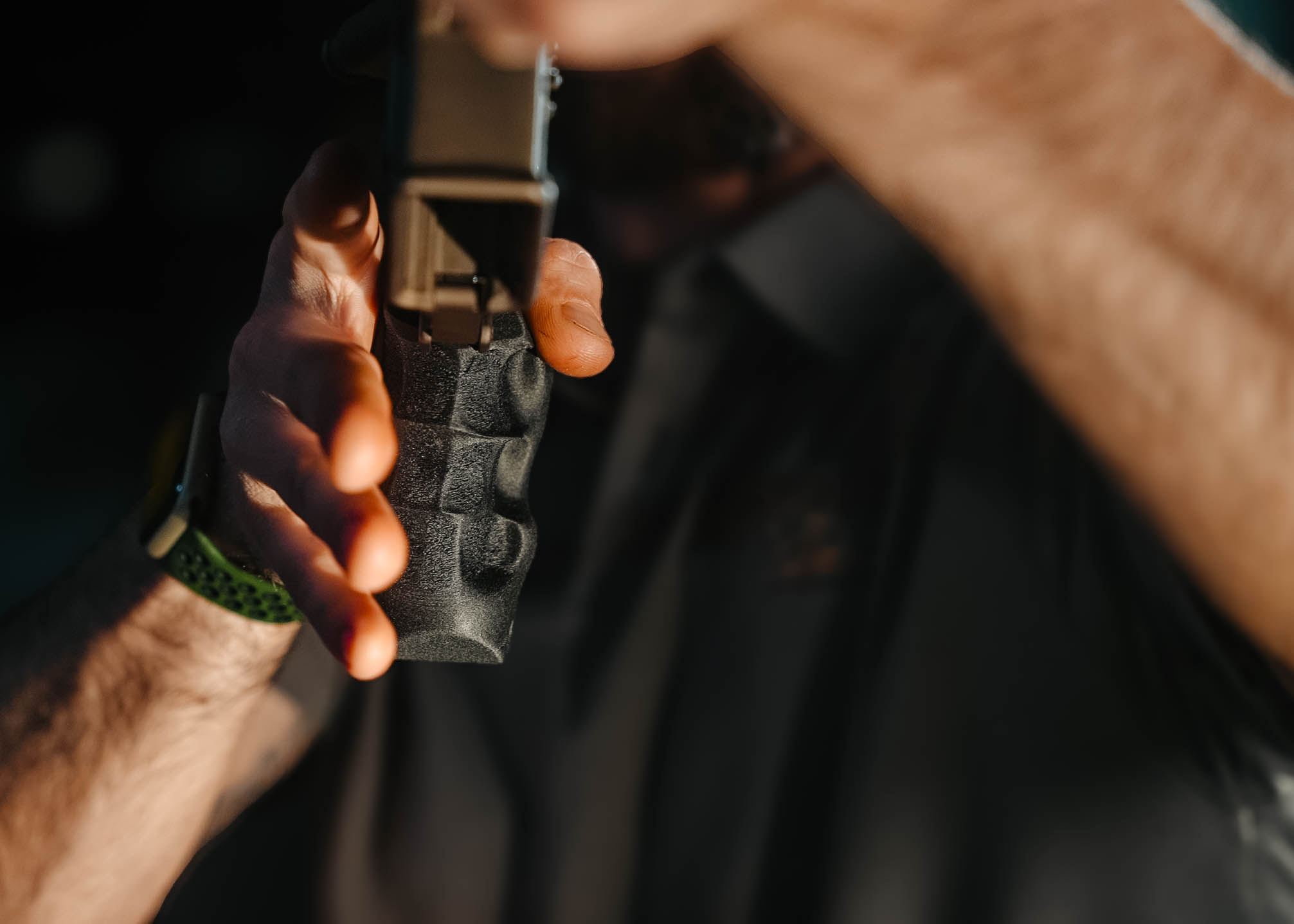 PrecisionFit grip in hand — texture detail